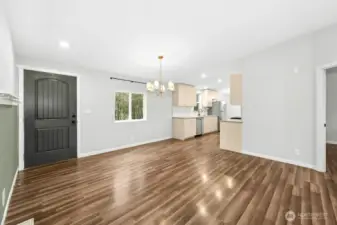 Front door entrance, formal dining room and kithen.