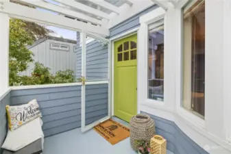 Front porch is protected from the rain by plexiglass.