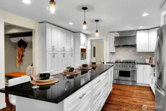 The updated kitchen includes a 6-burner stainless range, a roomy french door refrigerator and plenty of storage.