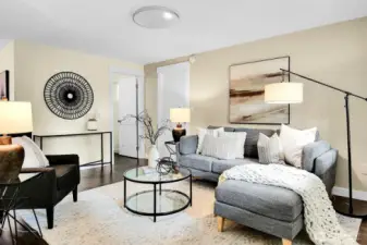 Hardwood floors and an adjacent half bath.