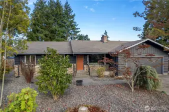 Beautiful rambler with new paint, cute porch, mature landscaping
