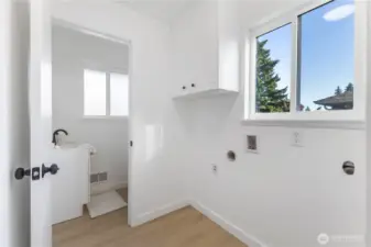 Mud/laundry area with storage and half bath