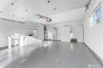 Clean, spacious garage with work space and storage