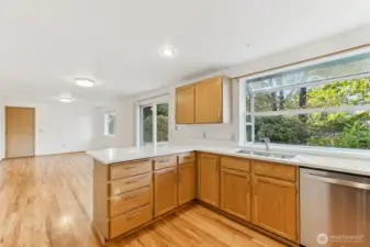 Kitchen looking into the additional family room. This area has beautiful hard wood floors.
