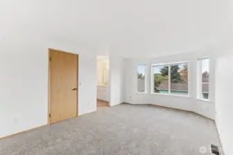 Primary bedroom with walk in closet and bathroom.