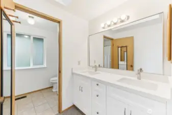 Primary bathroom has new double vanity with quartz counter tops.