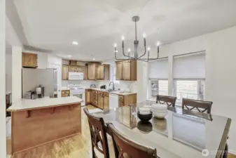Kitchen with updated lighting, new fridge