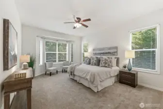 The primary bedroom easily accommodates a king sized bed.