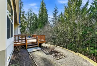 Off the deck is a garden bed and room to expand it. Or, this could be a nice spot for your four-legged friend!