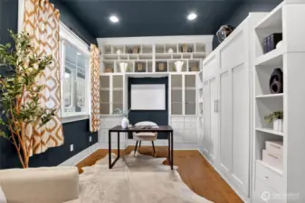 Main floor office has custom built ins and murphy bed, perfect for guests