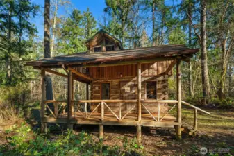 Covered deck was added after the move to the site.