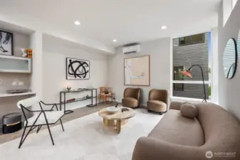 Large living room has ample space for a sectional, chairs, and entertainment center.  This picture does not do that space justice!