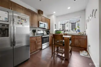Beautiful wood finishes and stainless-steel appliances in the kitchen.