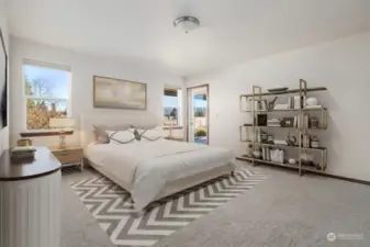 Primary Bedroom with new carpets and exterior door leading to backyard deck! Virtually Staged to give you a sense of the rooms potential.