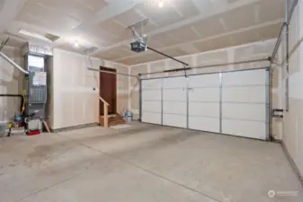 Clean and large 2 car garage with electric opener. Heater & H2O in garage.