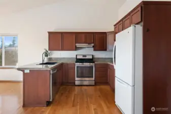 Kitchen with open & bright views to main living areas for easy conversations