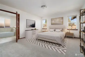 Large Primary Bedroom with double doors leading to walk in closet, large bathtub w/separate shower. Virtually Staged to give you a sense of the rooms potential.