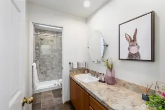 Full bath with walk-in custom tile shower, lots of great space, skylight.