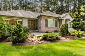 Mature landscaping thru the lot, easy path to front French doors.