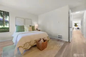 The primary bedroom is large and light and bright