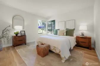 The primary bedroom is large and light and bright