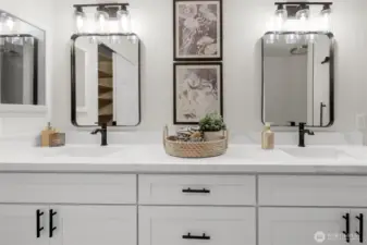 The primary bath is large and has a beautiful fresh vibe