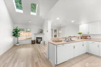 Entering Open Family Rm to Dining and Kitchen