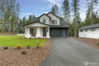 Ample off-street parking with attached 2-car garage and large driveway