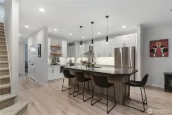9 foot ceilings, ample windows and light color tones provide uplifting mood and open feel