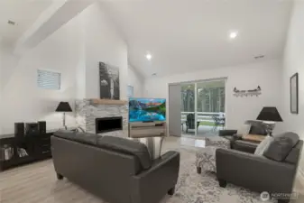 Vaulted family room with custom stone fireplace mantel