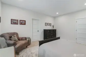 Primary suite showing private bath and walk-in closet entrances