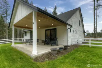 Oversized covered patio with pine soffit and lighting for endless hours of entertaining!