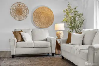 LIVING ROOM | The full-size couch and loveseat are almost dwarfed by the size of this living room. There's more than enough room for all your decor.