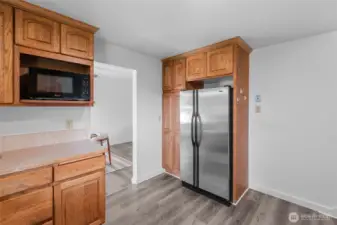KITCHEN | There's the fridge! And right next to it on the wall is that essential outlet for an old-school landline telephone. Avocado green anyone? Not quite pictured is the staircase to the right leading up to the bedrooms.