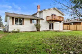 VIEW FROM THE REAR | This view shows windows from the dining room, kitchen, and sliding glass door from the family room.