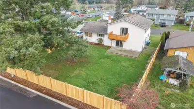 AERIAL VIEW OF THE BACK | This view shows off the size of the yard and beauty of the new fence.
