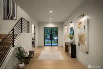 Large foyer featuring an art wall and 4" can lighting