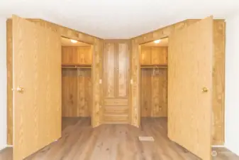 Walk-in closets on both sides with additional storage in the middle