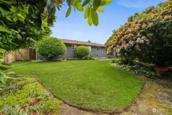 Lush landscaping, fully fenced & private backyard.
