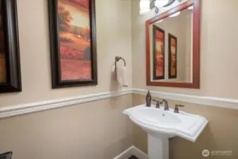 First floor powder room conveniently located close to garage too.