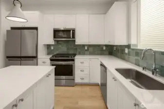 Fabulous kitchen layout with pretty tile backsplash