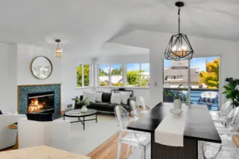One of 2 huge living rooms on the middle floor, each with a gas fireplace, a dining area and a deck.