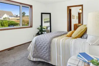 Primary bedroom with view of the First Lutheran church steeple, Liberty Bay & Olympic Mts.