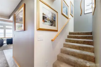 Upstairs is the primary and guest bedrooms with two bathrooms.