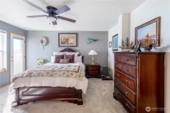 The primary bedroom is the perfect place to rest and relax.