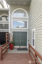 Rear, private entrance with additional covered and guest parking