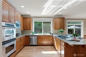 Kitchen with granite countertops and new appliances.