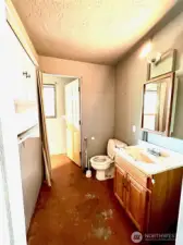 Lower level half bath connected to bedroom 3.