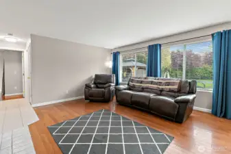 Lot of natural light throughout the home. Hallway to the left goes to the downstairs bedrooms.