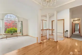 View of the Living room, entry way and entrance to 4th bedroom from the dining room.